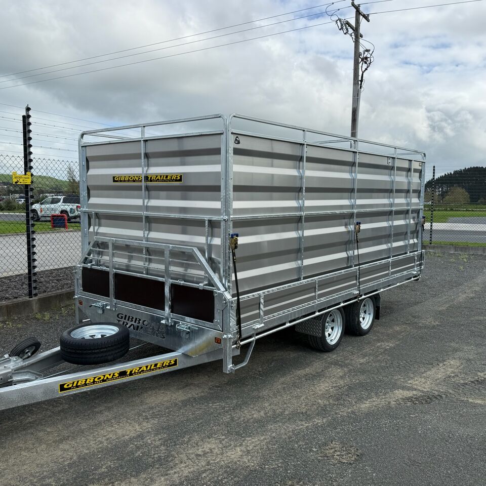 Heavy-Duty Trailer's Built to Perform Tandem axle livestock trailer manufactured by Gibbons Engineering parked outdoors at the workshop.